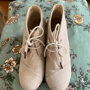 Tom’s light brown wedge booties (could be considered nude or cream colored)